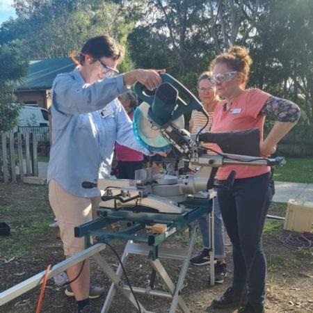 Woman receiving tool safety training.