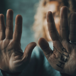 closeup of person holding hands up