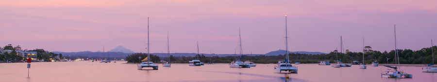 boats in water at sunset