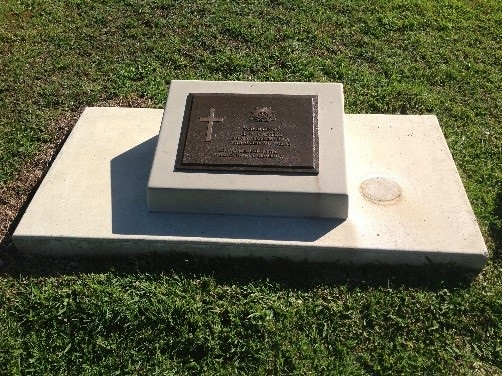 Concrete desk and base with a bronze plaque