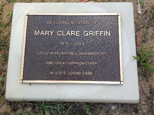 Lawn base with a bronze plaque
